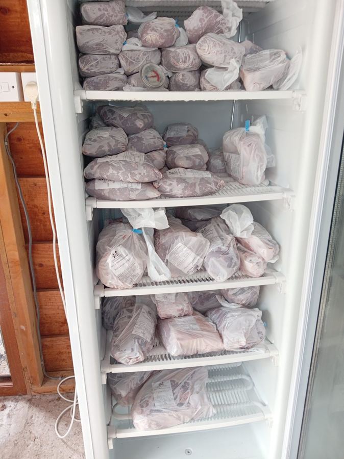The honesty freezer at Morton Farm Shop, five shelves stacked with bagged home-reared meat